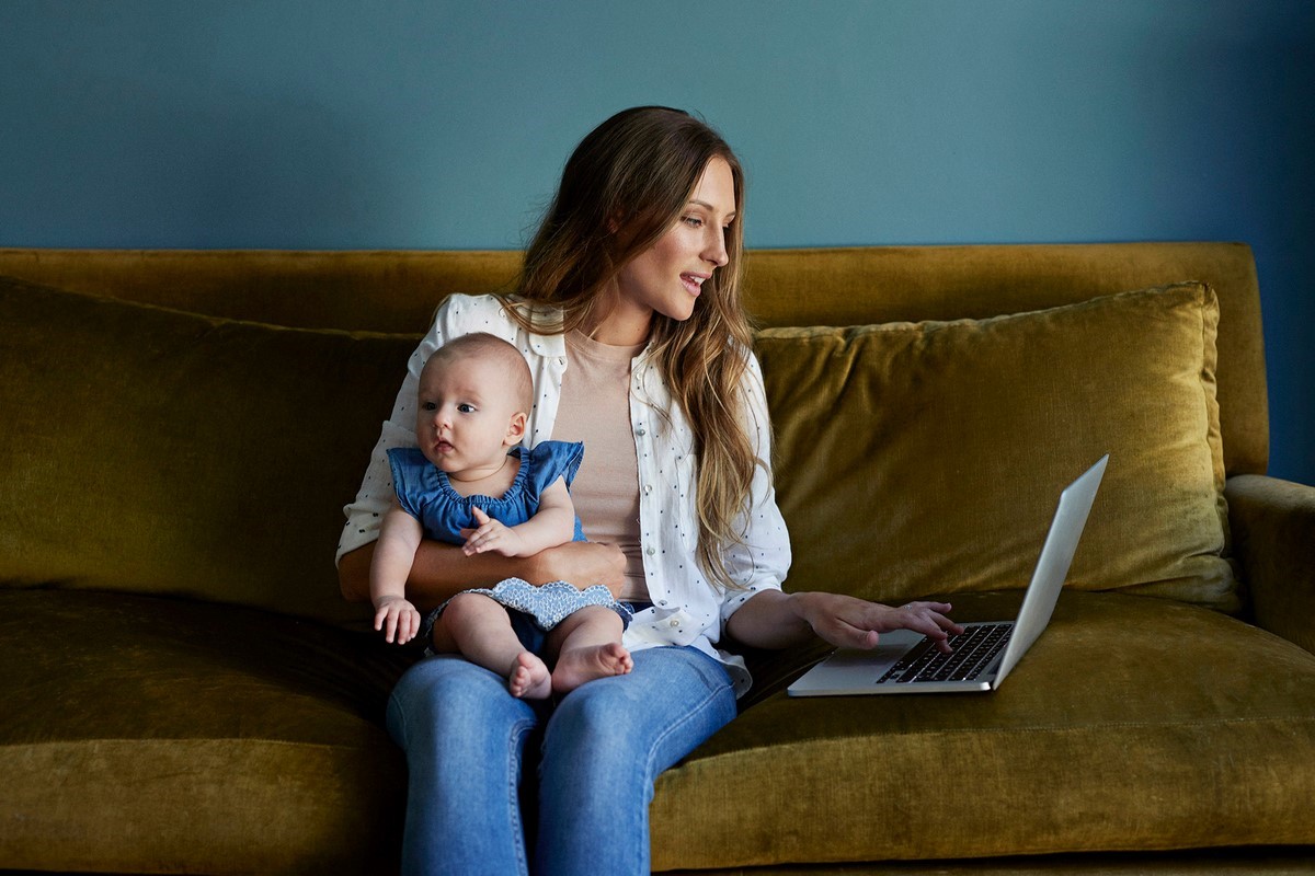 Mother with baby adapting to shopping digitalization during COVID-19