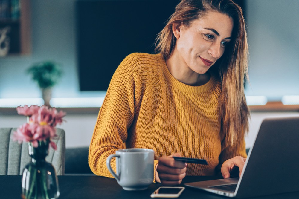 Woman shops online for Amazon Prime Day 1 deals