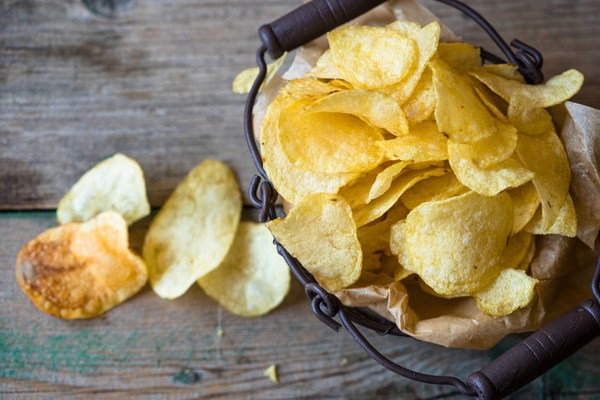 An angled view of a potato chip snack sitting on a table