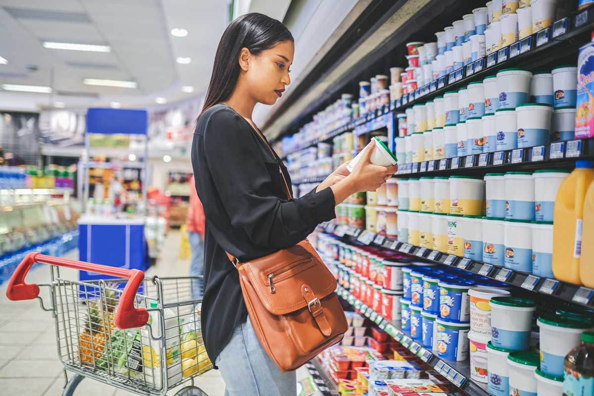 Woman looking at product label