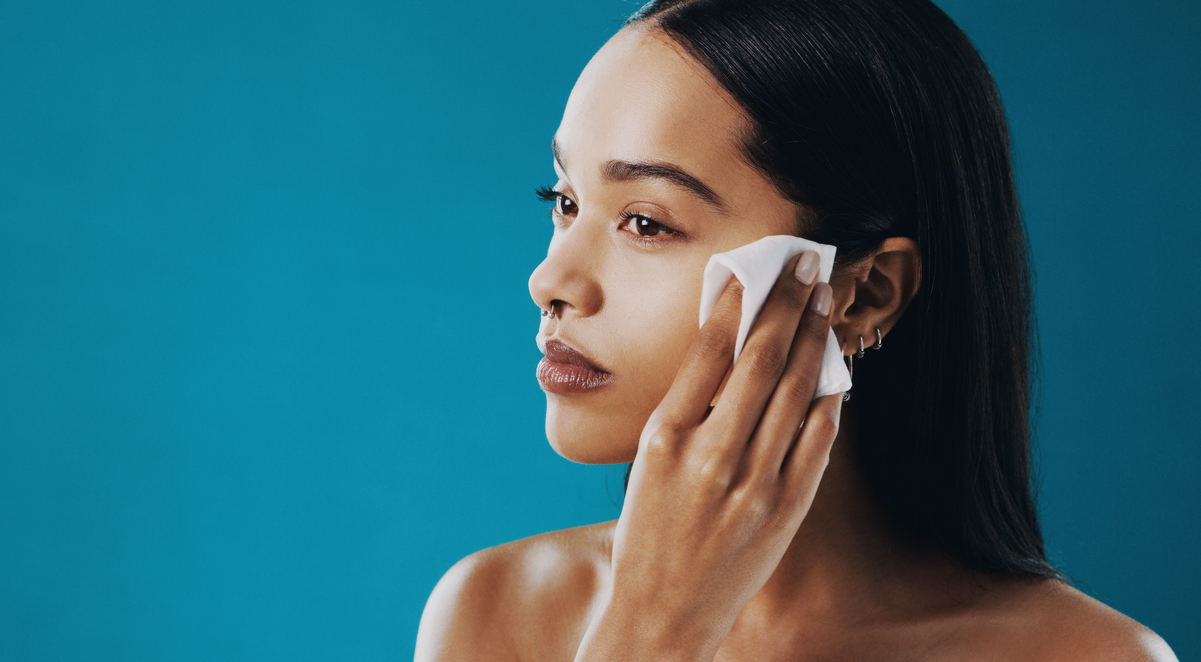 Cropped shot of a beautiful young woman using a wet wipe to remove her makeup