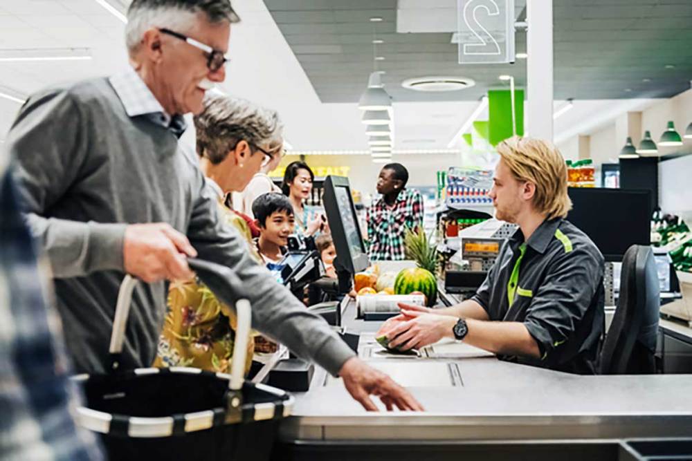 Shoppers in line at a register