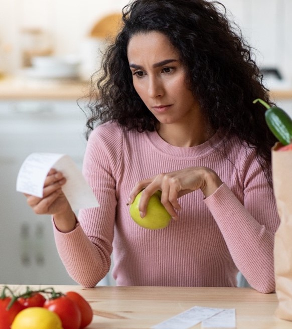 Consumer spending - woman reviewing a receipt