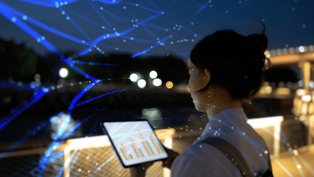 asian girl looking a tablet in the night