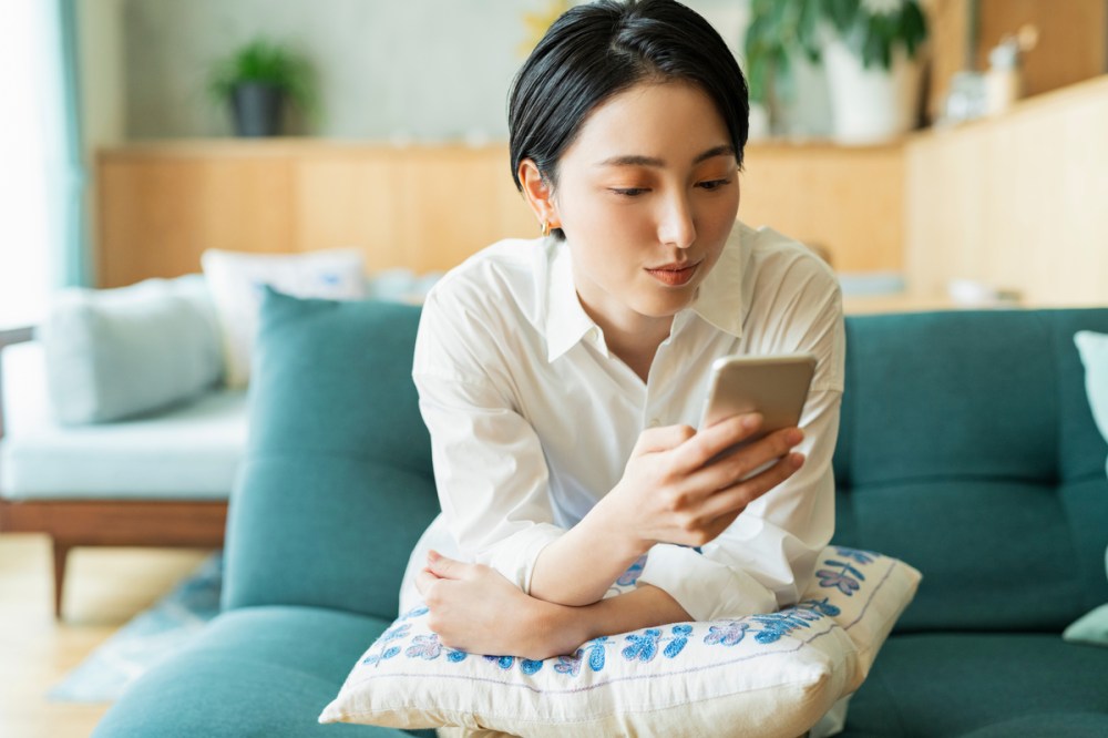 A person using their phone to view out top 2025 insights